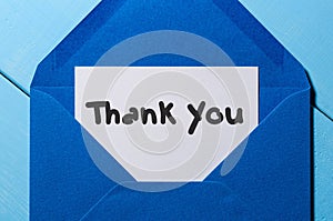 Letter with the words thank you at blue envelope