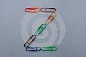 Letter Z made with colorful paper clips on white background