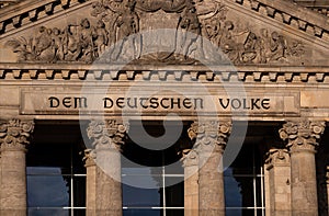 Lettering `DEM DEUTSCHEN VOLKE` the German people on the Bundestag building in Berlin