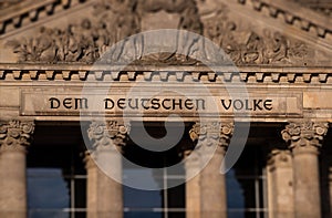 Lettering `DEM DEUTSCHEN VOLKE` the German people on the Bundestag building in Berlin