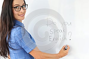 Lettering do you speak english on white board closeup