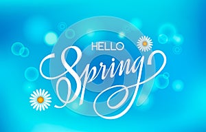 Lettering greeting card. Handwritten lettering. Hello spring on a bright blue sky background with bokeh effect and spring meadow