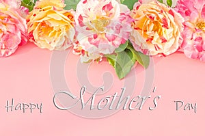 Lettering Happy Mother`s Day with delicate multi-colored roses on a pink background