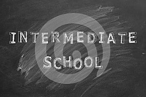 Intermediate school. Text on blackboard