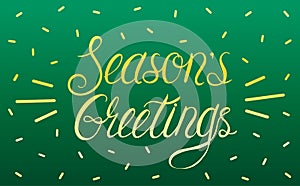 Lettering phrase Seasons Greetings on a dark green background in yellow