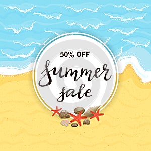 Lettering Summer Sale on round card on sandy beach