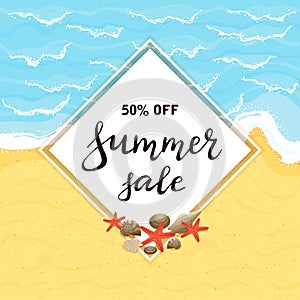 Lettering Summer Sale on white card on sandy beach