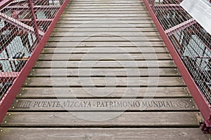 Lettering unesco puente vizcaya-patrimonio mundial on the suspension bridge of bizkaia puente de vizcaya between getxo and