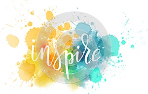 Lettering on watercolored background. Inspire.