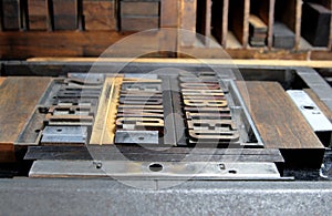 Letterpress type in a printer's chase