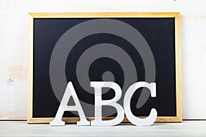Letters ABC and chalk board