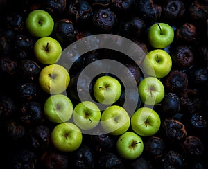 letters of the alphabet lined with green apples