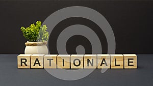 letters of the alphabet of rationale on wooden cubes, black background photo