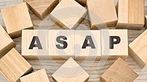 Letters asap on toy wooden blocks and empty details