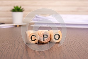 letters CPO written on wooden cubes. Cost Per Order concept