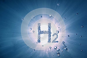 letters hydrogen h2 with lot of bubbles in a blue water with sun