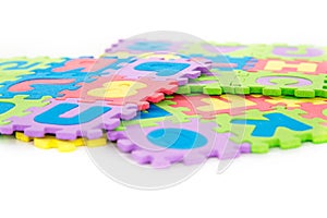 Letters and numbers colourful puzzle for children play. Soft toy