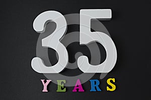 Letters and numbers thirty-five on the black background.