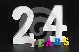 Letters and numbers twenty-four years on a black background.