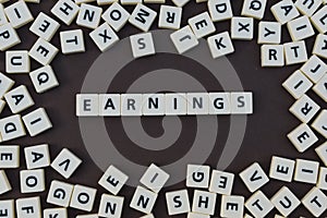 Letters spelling out earnings