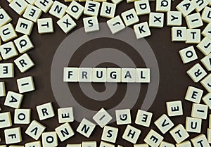 Letters spelling out frugal