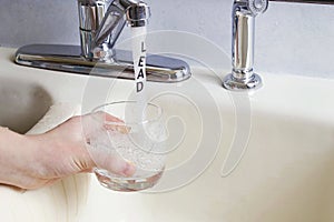 Lead In Tap or Drinking Water Running in Stream of Water photo