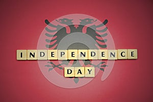 Letters with text independence day on the national flag of albania.