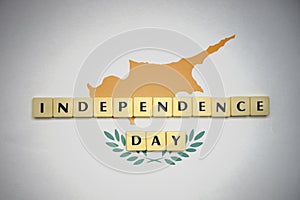 Letters with text independence day on the national flag of cyprus.