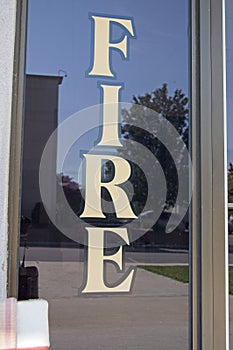 Letters on window that spell FIRE