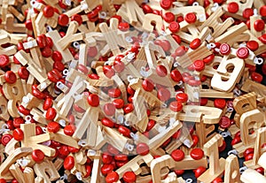 Letters in wood with Red wheels to compose words and name of chi