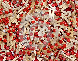 Letters in wood with Red wheels to compose words and name of chi