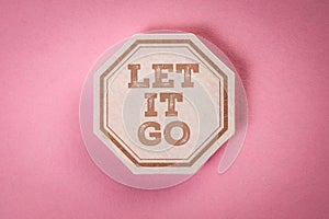 Letting Go Concept on Pink Background with Motivational Message in Octagon Shape