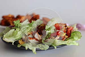 Lettuce chicken wrap. Tandoori chicken bites, sauteed baby corn, fresh cut tomatoes and onions tossed and wrapped in iceberg