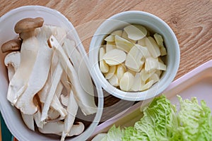 Lettuce, Eryngii Mushroom, cucumber, and garlic, side dishes of Korean Barbecue, Korean traditional grilled BBQ food