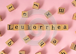 Leukorrhea word on wooden cube photo