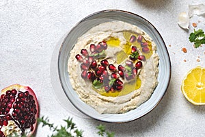 Levantine appetizer Baba ghanoush baked eggplant appetizer served with pomegranate seeds photo