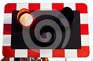 Level crossing lights signalling to road user to stop