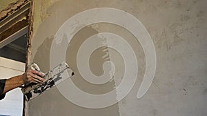 leveling the wall with a layer of plaster next to the doorway