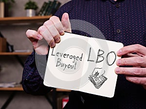 Leveraged Buyout LBO is shown on the business photo using the text