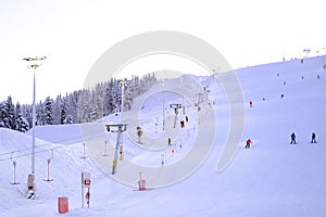 Levi ski resort, toboggan run, funicular cabins go uphill, , spruce in snow, beautiful winter landscape, concept holiday in