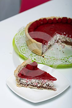 Levington sliced cake with raspberry jelly, chocolate and coconut. Garnished with raspberries