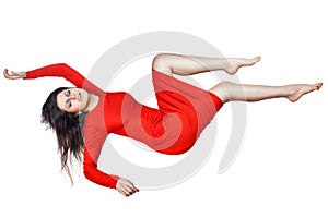Levitates woman in a red dress.