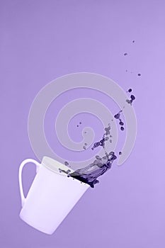 Levitating coffee mug with splashes. Coffee concept. Minimal art