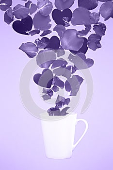 Levitating coffee mug with splashes of rose petals and hearts. S