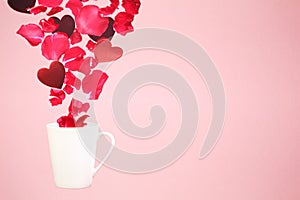 Levitating coffee mug with splashes of rose petals and hearts. Surprise, holiday and coffee love concept. Minimal art trend. Solid