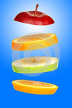 Levitating fresh sliced fruit