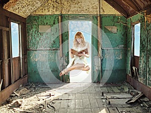 Levitating lady reading in the hovel photo