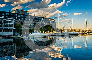 Lewis Wharf and boats reflecting in the Boston Inner Harbor, in