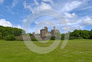 Lews Castle now owned and run by the Stornoway Trust, under blue skies with scattered clouds