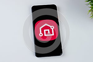 LG ThinQ app logo on a smartphone screen.